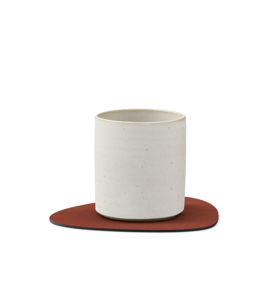 tea cup on a glass mat
