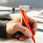 someone writing with a Prodir pen