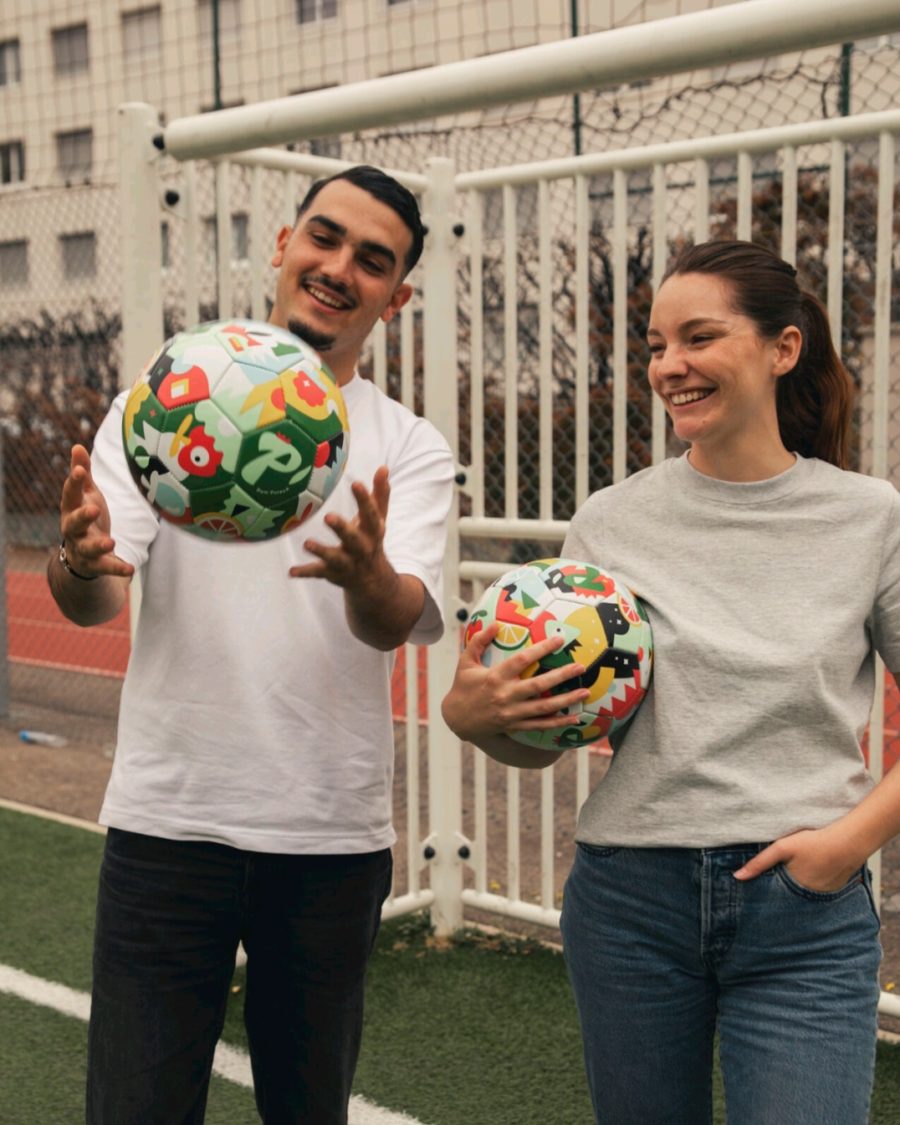 two persons playing with the graphic ball